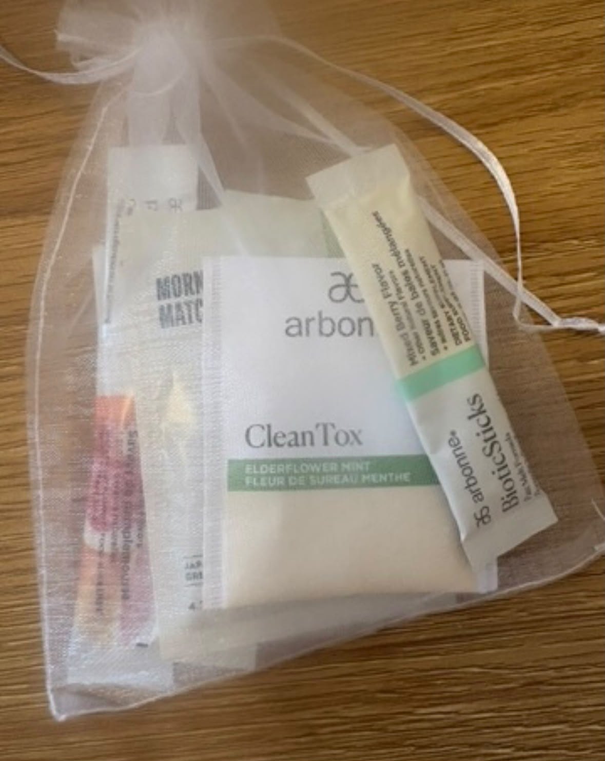 Arbonne product samples in a small gift bag